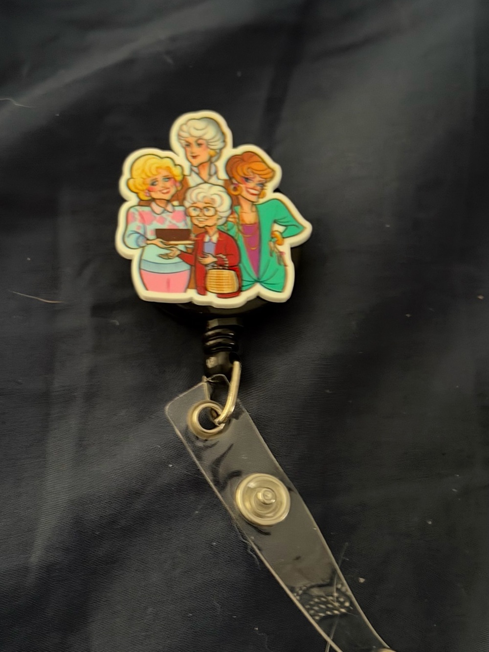 Vintage-Inspired Goldens Retractable Badge Reel with Multicolor Character Art